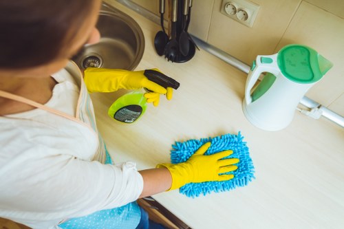 Professional cleaner preparing a guest-ready rental in Soho