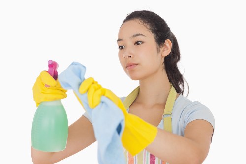 Cleaning kitchen surfaces and fixtures after renovation in Soho