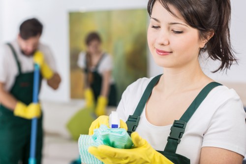 Staff member assessing cleaning risks in a Soho interior