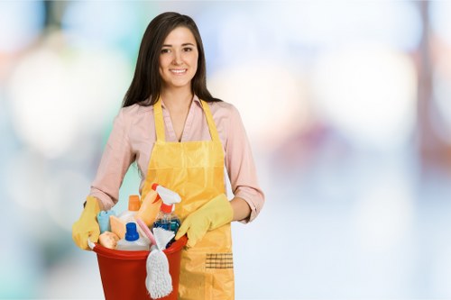 Cleaning team applying health and safety measures in the workplace